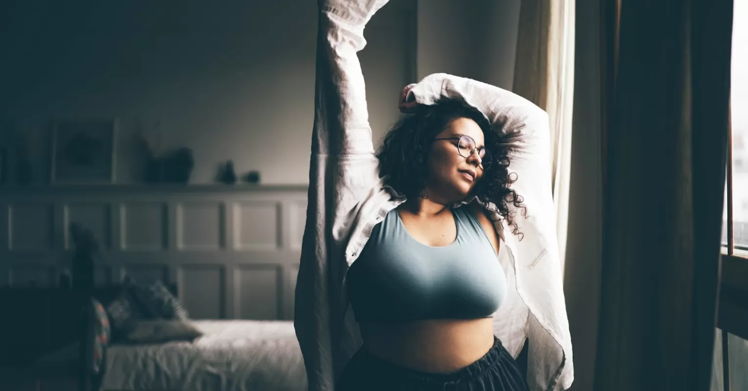 Individual contemplating body image issues and feelings of insecurity in a reflective moment