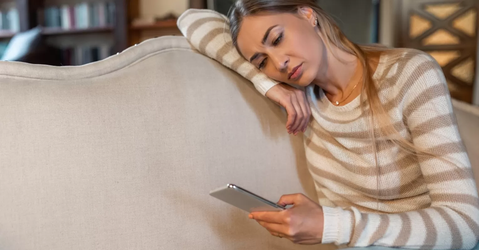 Individual contemplating feelings of sadness after a breakup and emotional turmoil