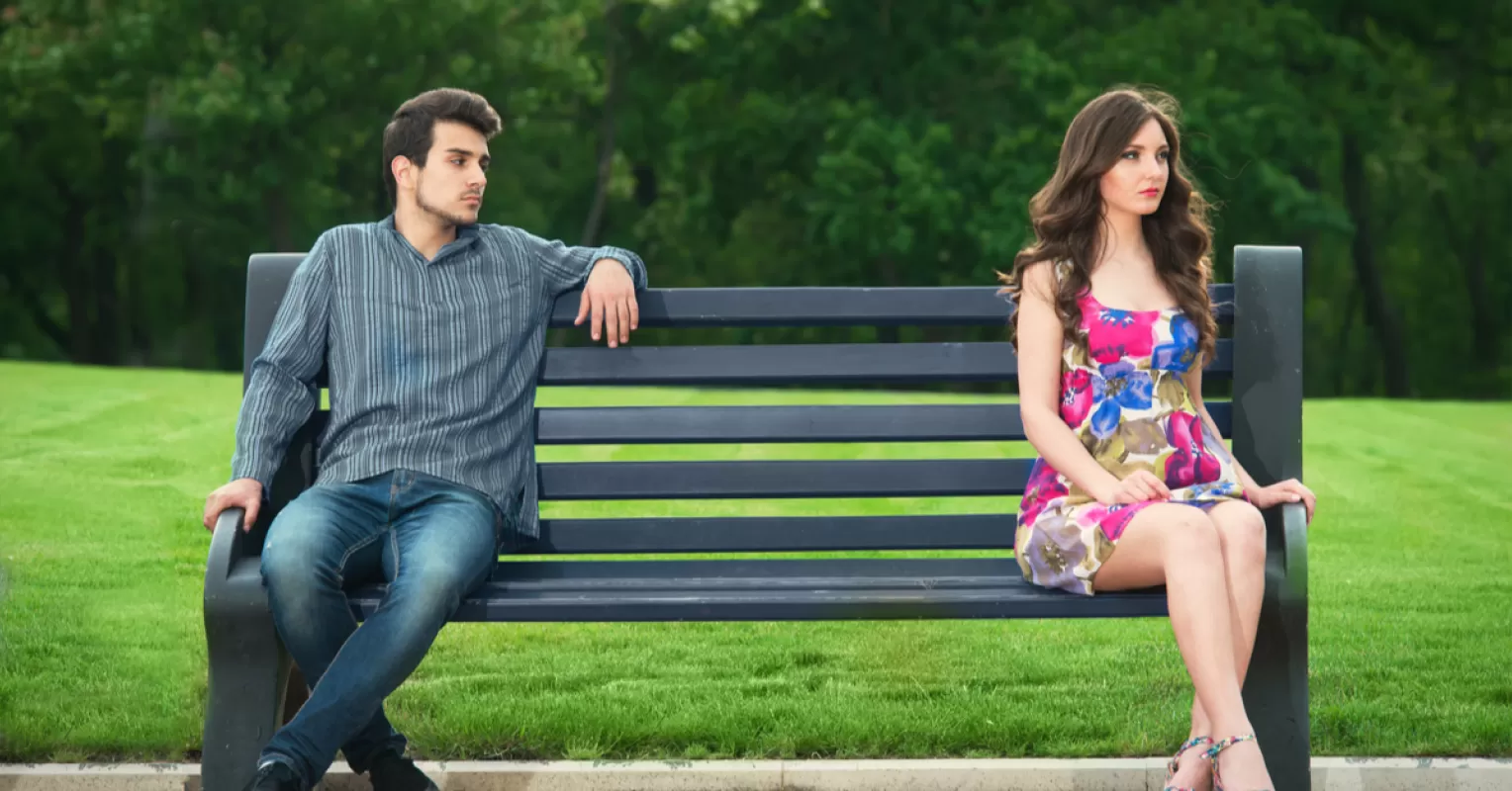 Couple discussing feelings of attraction and the urge to cheat in a cozy setting