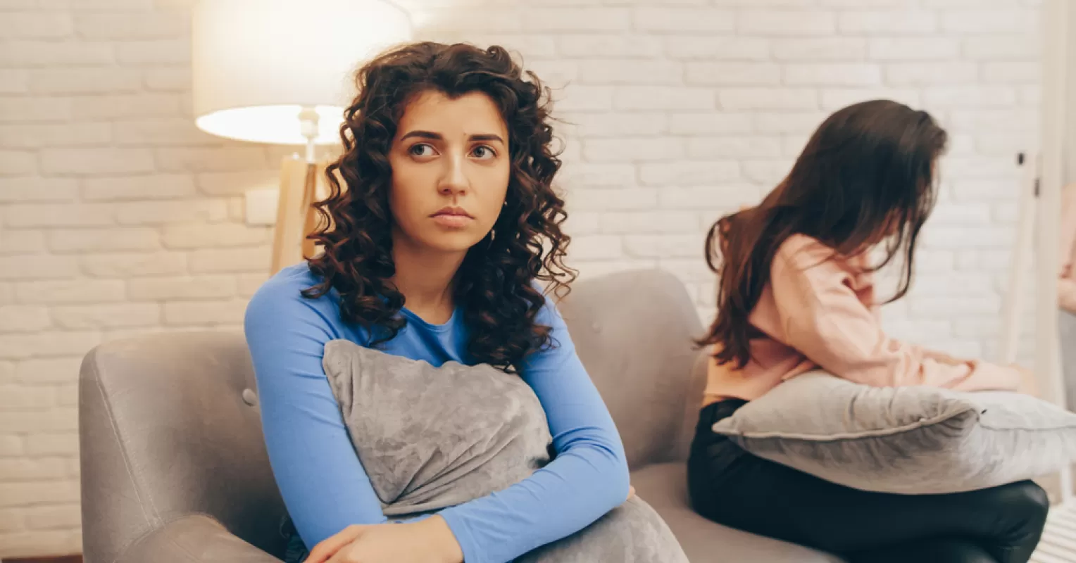 Individual feeling uneasy in a crowded social setting, reflecting on discomfort in social situations