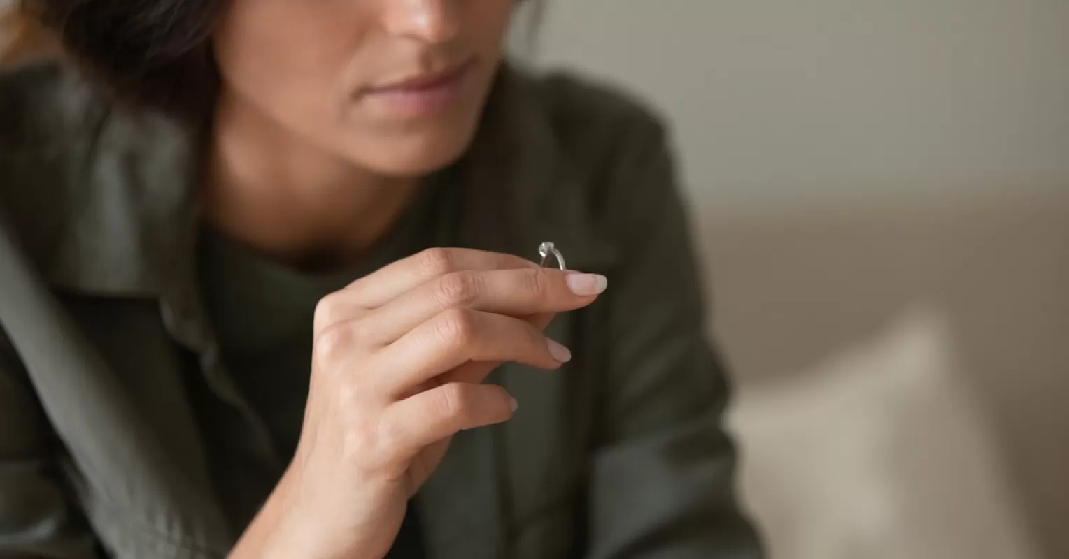 Woman contemplating the reasons behind divorce initiation in relationships