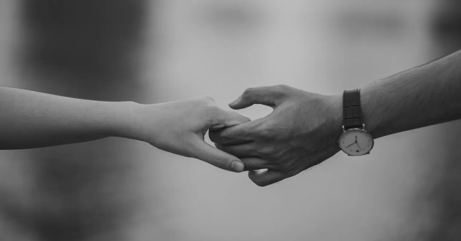 Person reflecting on uncertainty in a relationship connected to do opposites attract in relationships