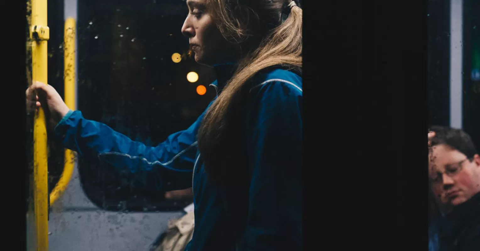 Individual feeling isolated in a social setting, struggling with feelings of worthlessness