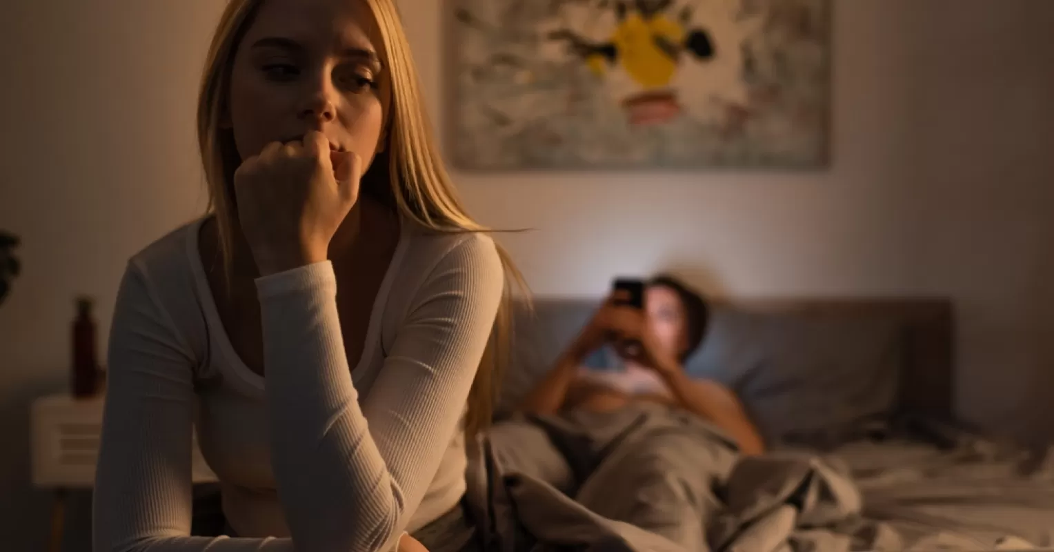 Individual contemplating feelings of guilt after cheating in a relationship