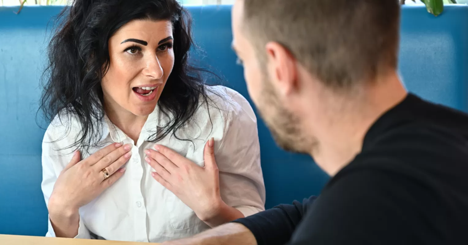 A person looking frustrated while trying to communicate with a passive-aggressive friend