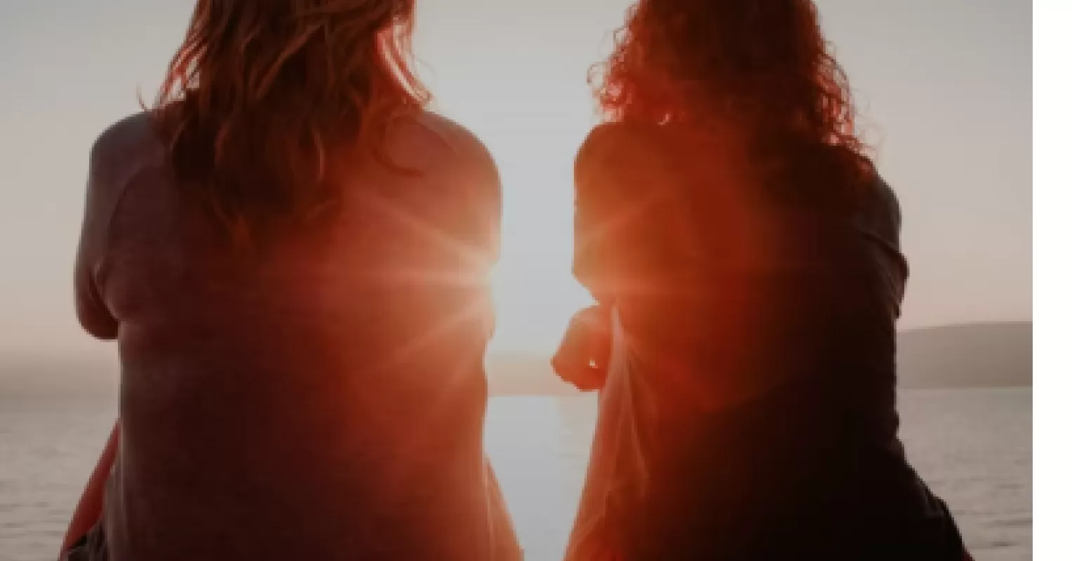 Two friends having a serious conversation about ending a long-term friendship with empathy