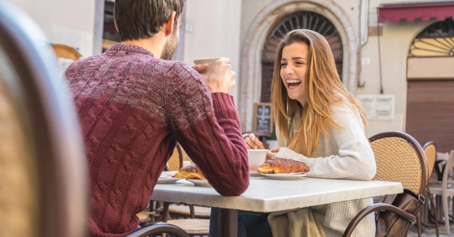 Person contemplating how to follow up after a first date, feeling hopeful yet anxious