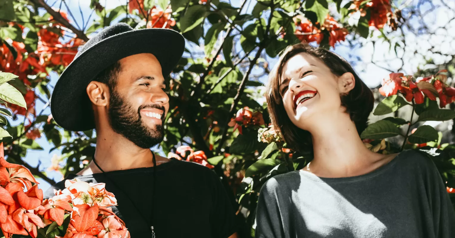 Couple sharing a laugh on a first date, signaling connection and comfort