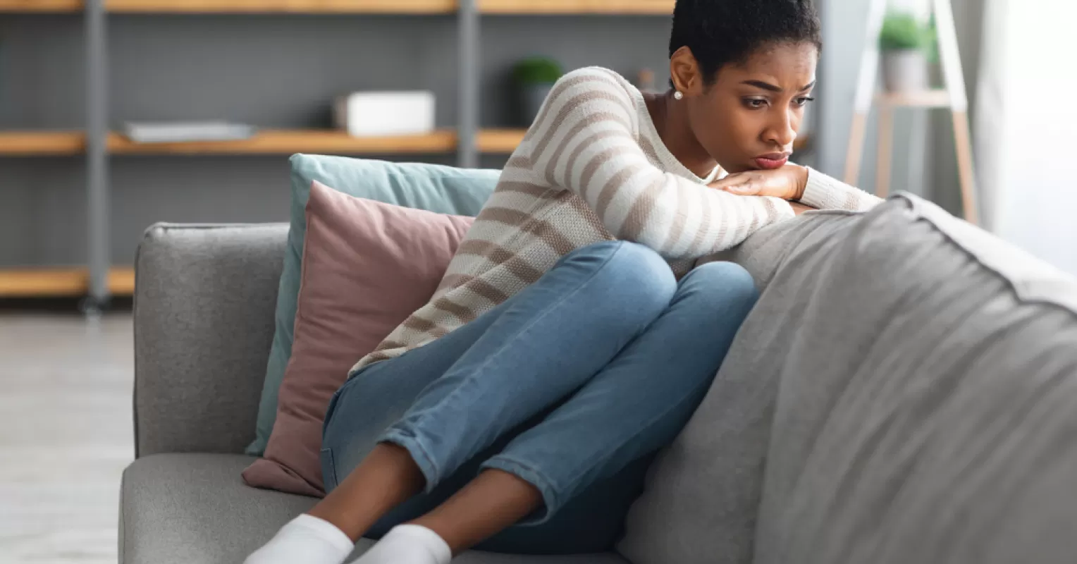 Individual journaling feelings of loss and confusion after a breakup, exploring emotional processing.