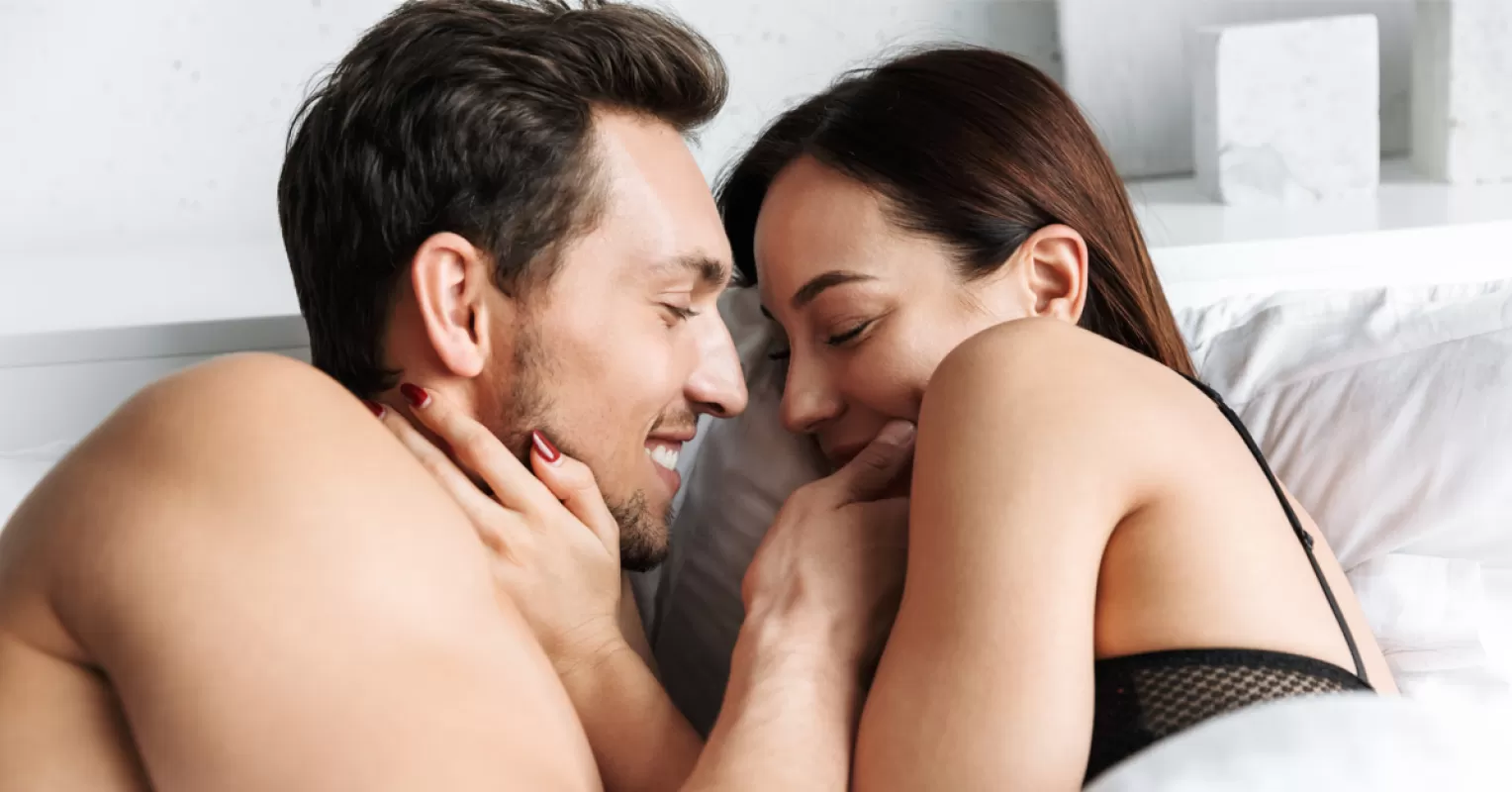 Couple sharing a tender moment, exploring signals to rekindle romance in a marriage