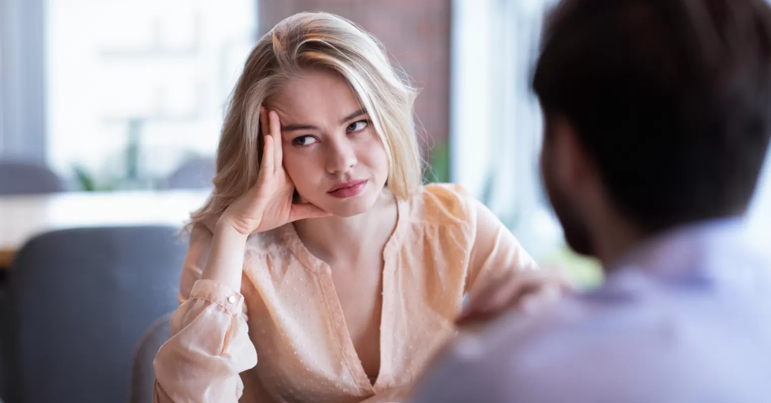 Couple discussing emotional triggers to prevent arguments from escalating during a conversation