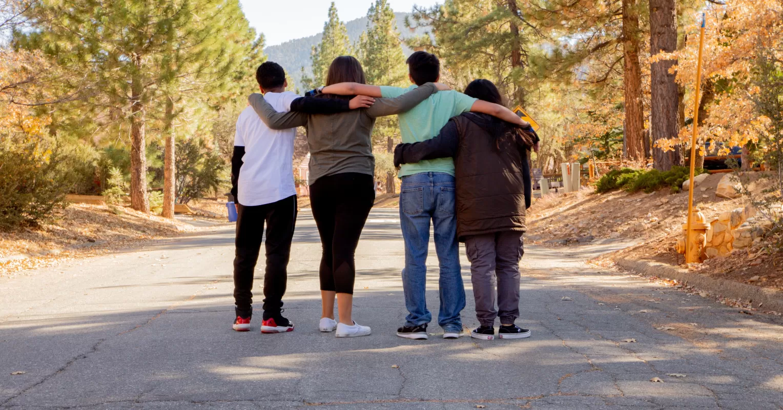 Teenagers engaging in a group activity that fosters empathy and social dynamics