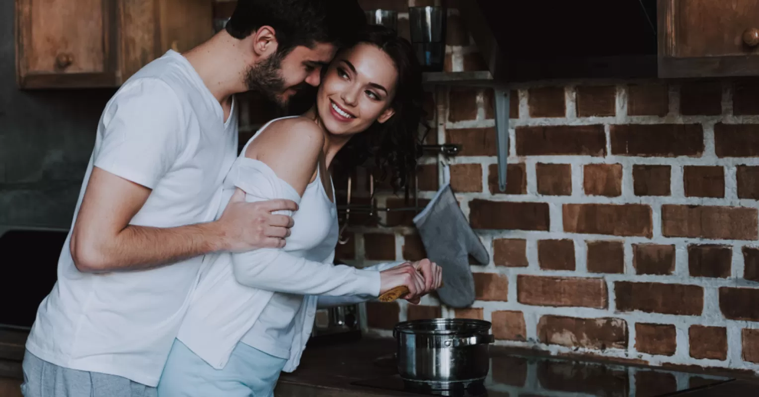 Couple sharing a tender moment, exploring signs of love versus infatuation