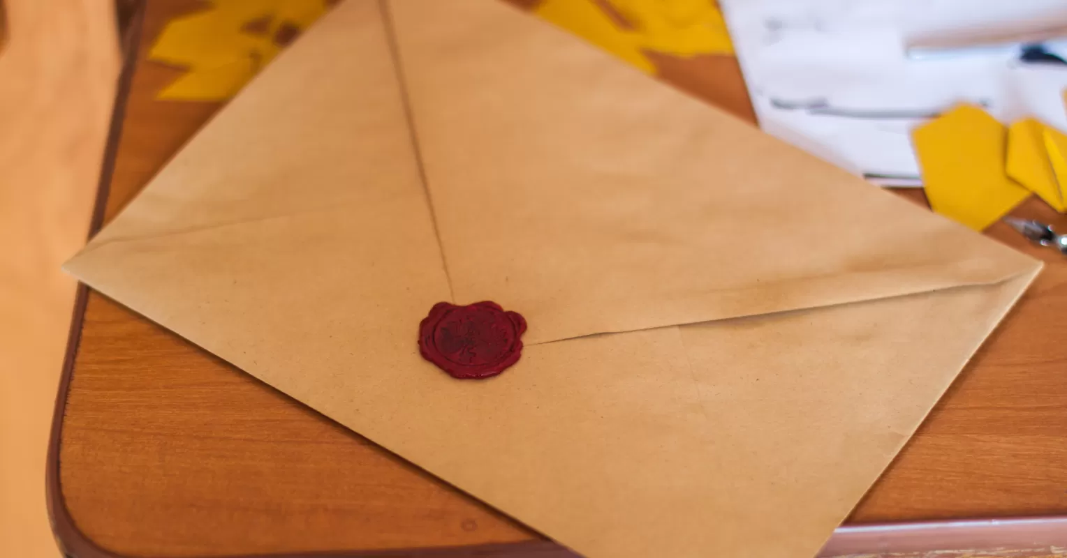 Person writing a heartfelt note to express gratitude for life-changing support