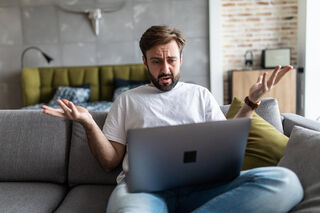 Employee managing frustration during a tense meeting about workplace anger