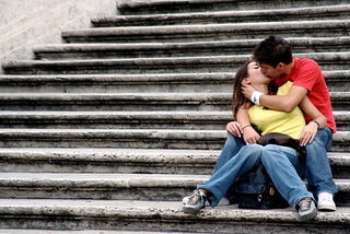 Two people leaning in for a first kiss, signaling mutual attraction and anticipation