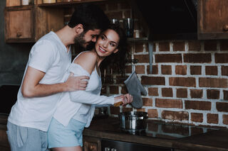 Couple sharing a tender moment, contemplating if it's love or infatuation