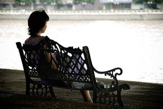 Elderly person sitting alone, reflecting on signs of loneliness in elderly life