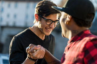 Person noticing subtle social behavior signals connected to how to make friends in a new job