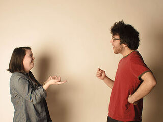 Two friends engaging in a challenging conversation, highlighting social dynamics in difficult discussions