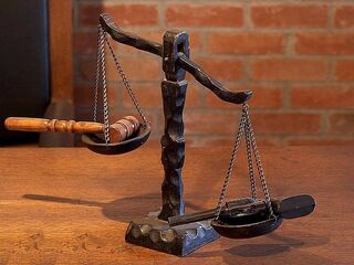Individual reflecting on personal biases to stop being judgmental in social dynamics