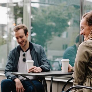 Person contemplating how to follow up after a first date, feeling hopeful yet anxious