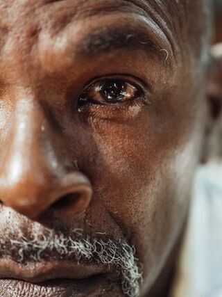 Individual experiencing emotional turmoil while contemplating the stages of grief in divorce