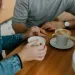 A person listening intently while another expresses defensive emotions during a conversation