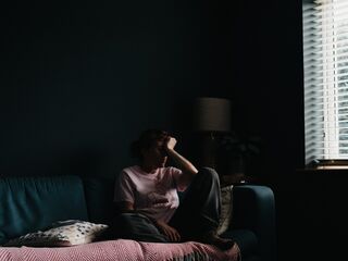 Individual contemplating their fear of intimacy while pushing loved ones away