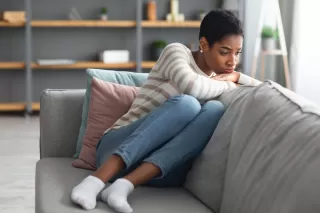 Individual reflecting on emotions after a breakup, contemplating relationship signals and feelings