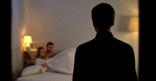 Person reflecting on emotional behavior and meaning connected to what to do if you suspect infidelity