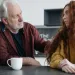Parent and teenager discussing feelings about divorce in a supportive environment