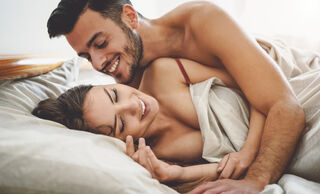 Couple sharing an intimate moment, reflecting on what it means to be sexually satisfied