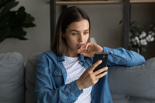 Individual experiencing emotional pain while reflecting on ghosting versus rejection in relationships