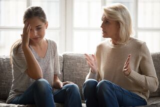 Colleagues navigating a tense meeting while dealing with arrogant behavior at work