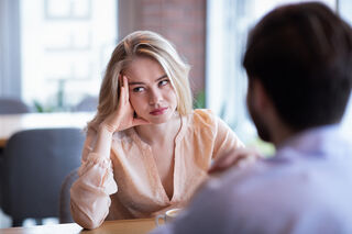 Couple discussing emotional triggers to prevent arguments from escalating during a conversation