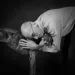 A friend comforting another person grieving the loss of a pet, showcasing emotional support.