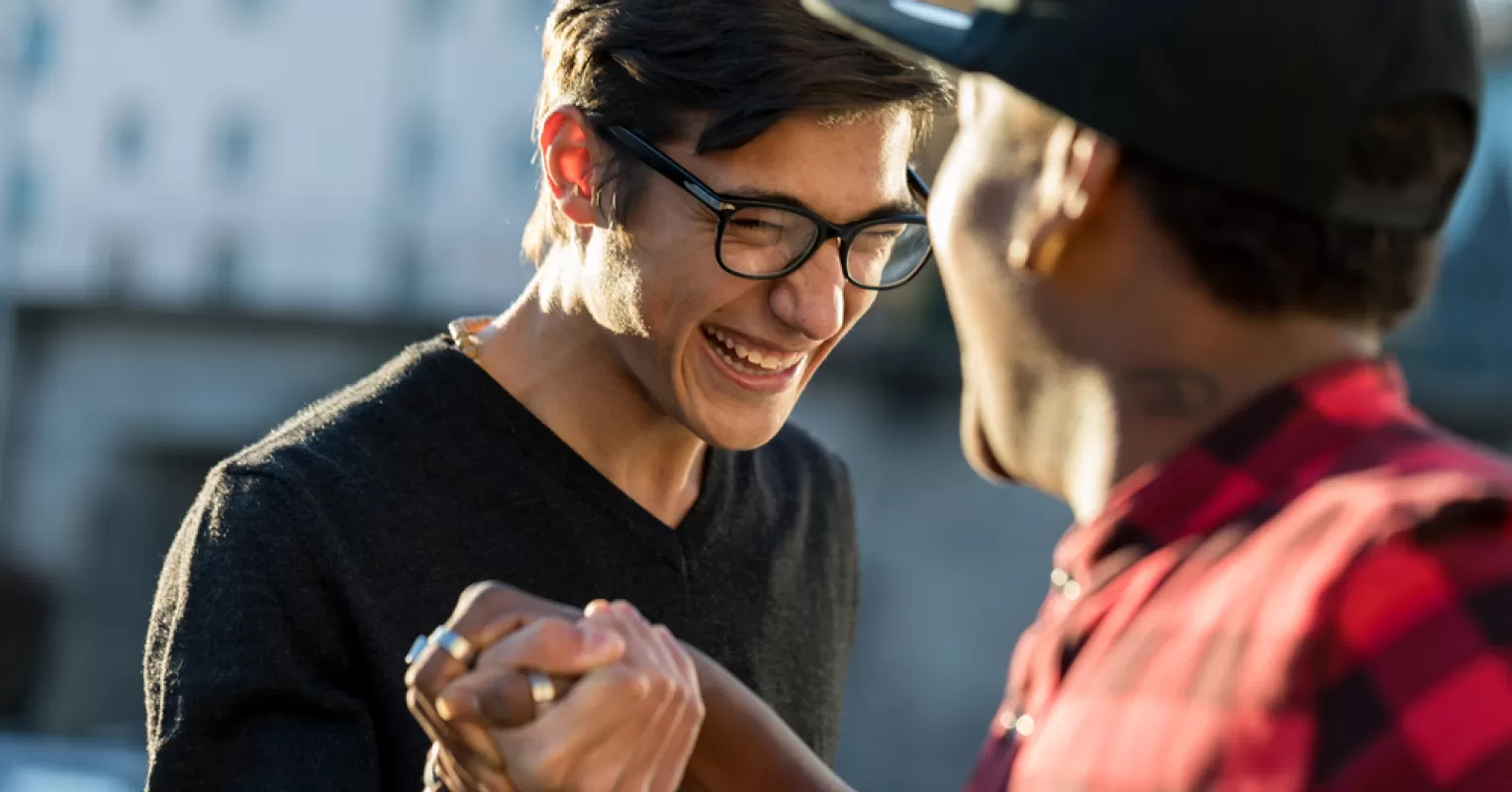 Person noticing subtle social behavior signals connected to how to make friends in a new job