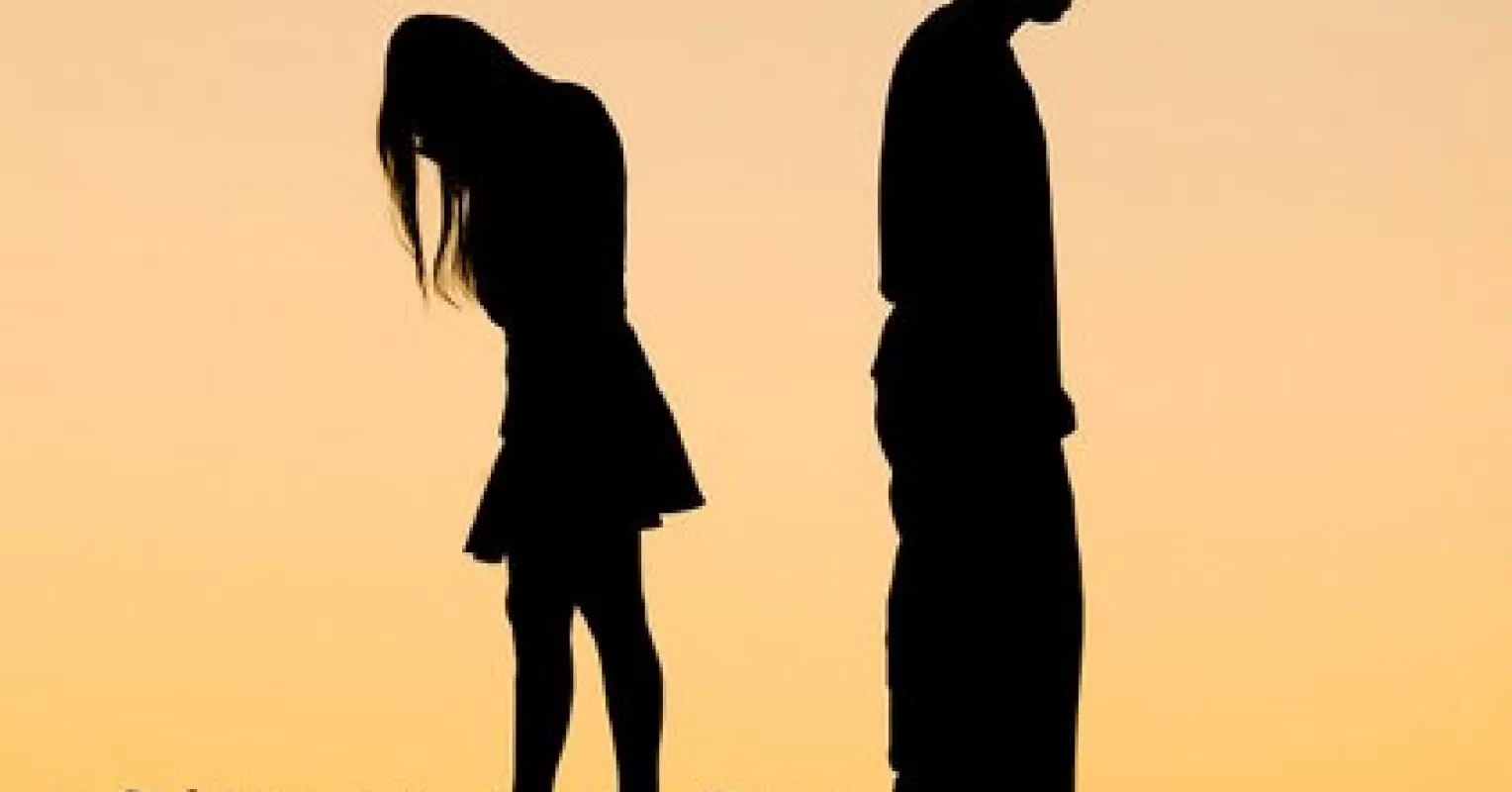 Individual experiencing a range of emotions during the emotional stages of a breakup