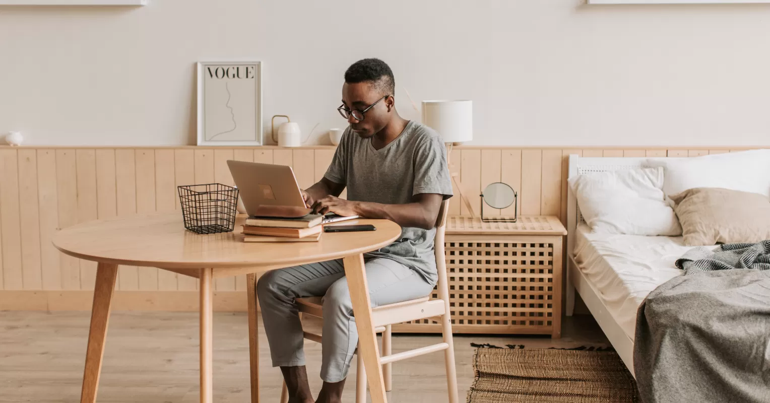Remote worker focused on tasks while balancing personal life at home