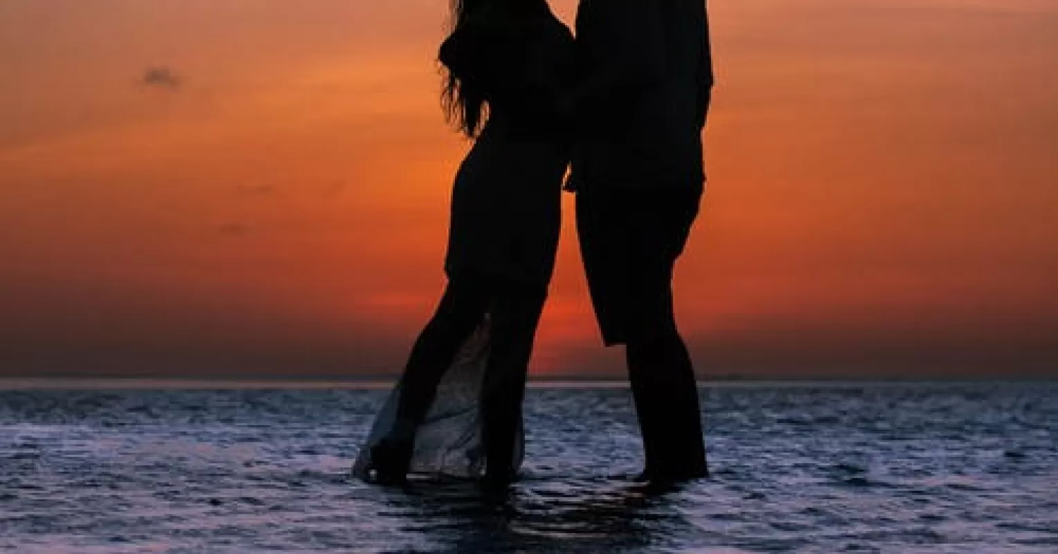 Individual experiencing intense emotions while captivated by someone special