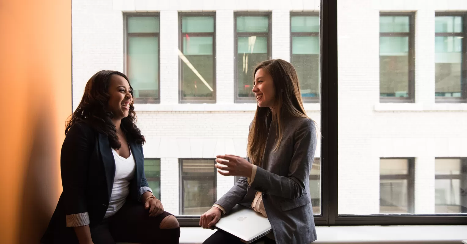 Two friends engaged in a deep conversation, illustrating what it means to be on the same wavelength.