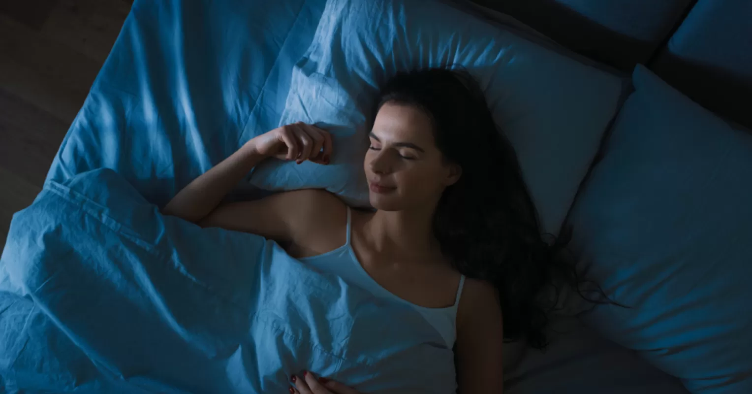 Person contemplating the meaning of dreams about sex and their relationship signals