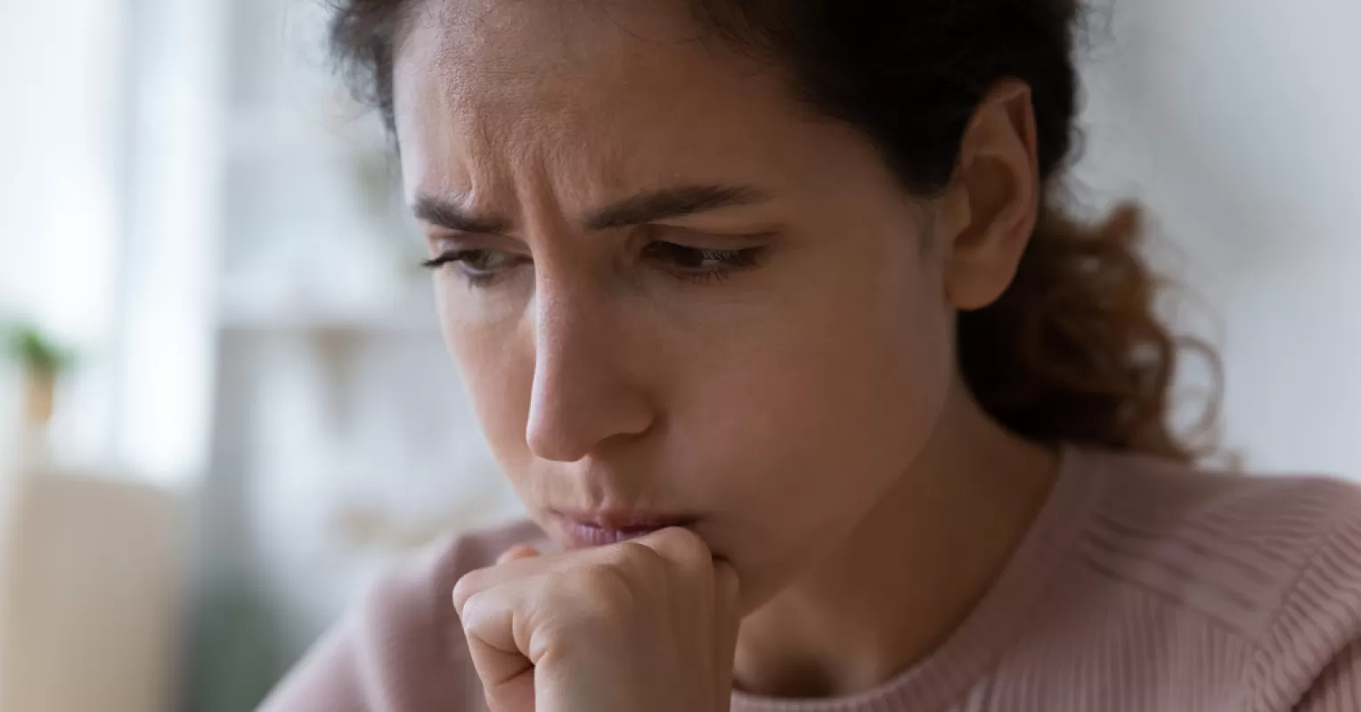 Individual contemplating choices, reflecting on what it means when someone is indecisive