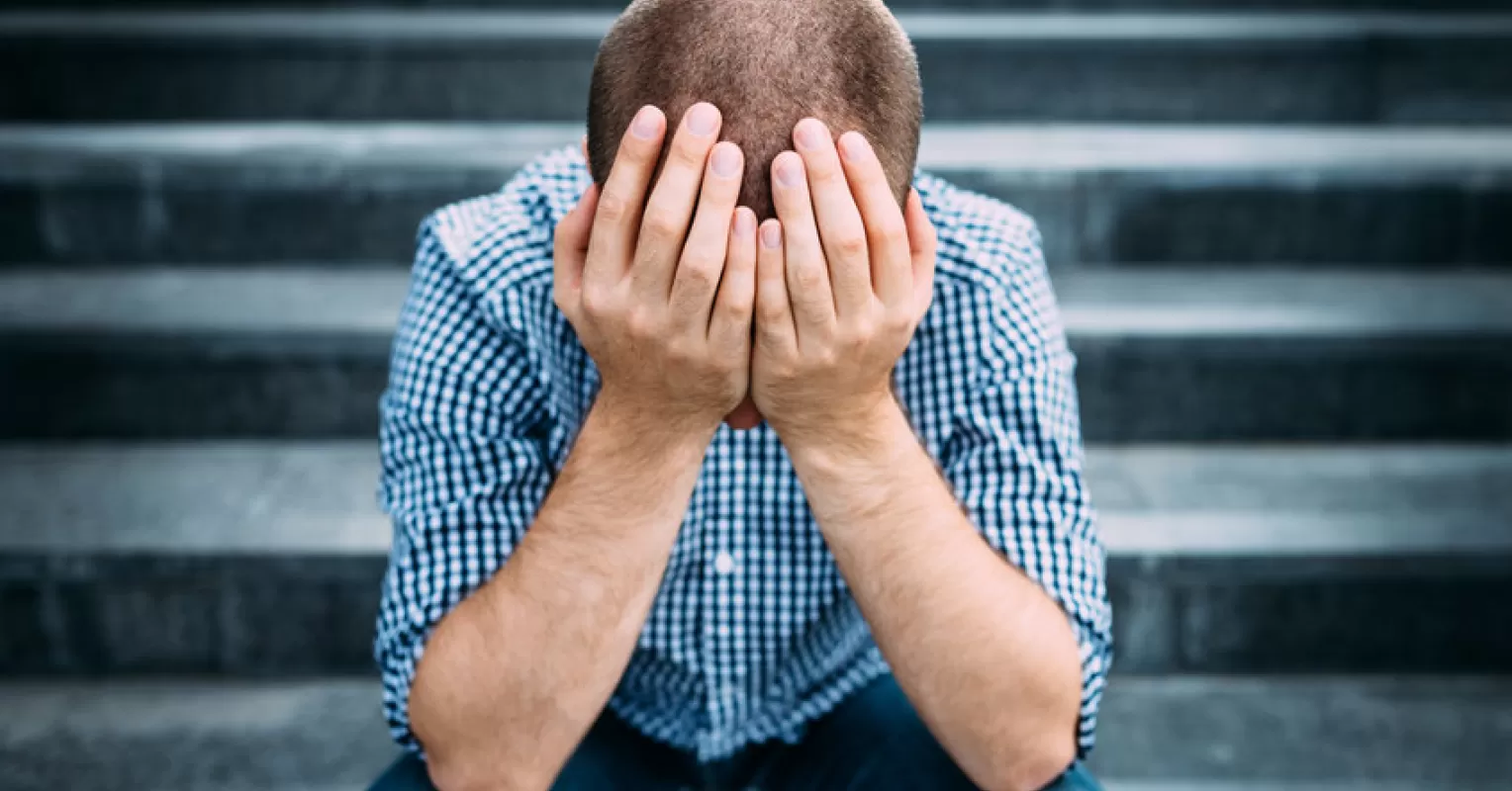 Individual contemplating the emotional patterns of guilt versus shame in a quiet setting